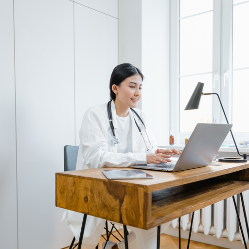 photo of woman writing on a desk